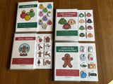 A set of three spiral-bound Christmas  themed interactive adapted books for special education, with various Christmas-related illustrations and activities designed for academic skills practice.