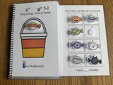 Special Education adapted book with Halloween-themed pages, moveable pieces and symbol supported text on a wooden surface