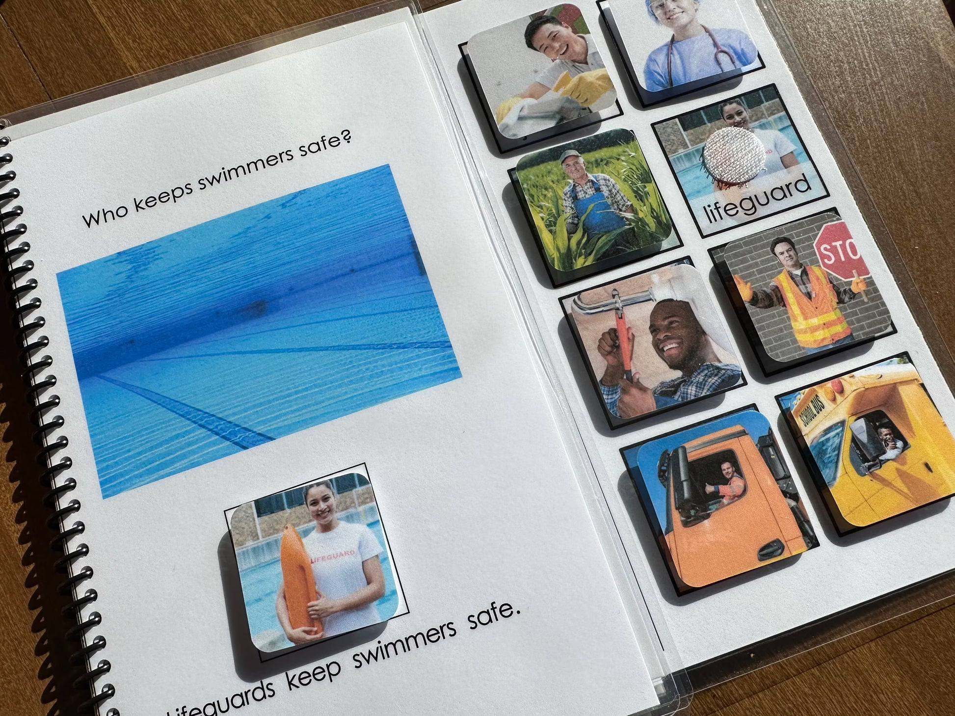 Adapted book with images of lifeguards and a pool, emphasizing safety.