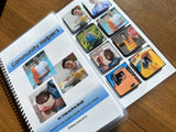Open book titled 'Community Helpers' with interactive cards on a wooden surface