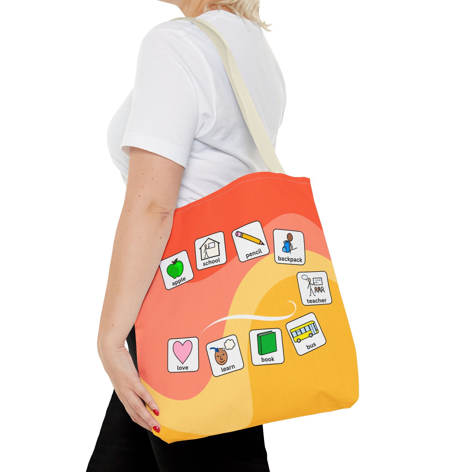 Person holding a personalized special education teacher tote bag with colorful icons on a white background