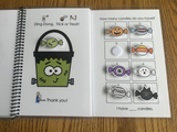 Adapted book with Halloween-themed symbols and pictures on a wooden surface