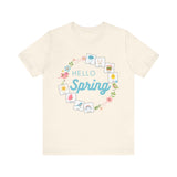 Cream tshirt that says "hello spring" and includes a flower border and 8 symbol cards commonly used with AAC and special education