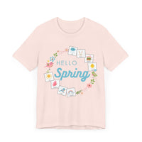 Light pink tshirt that says "hello spring" and includes a flower border and 8 symbol cards commonly used with AAC and special education