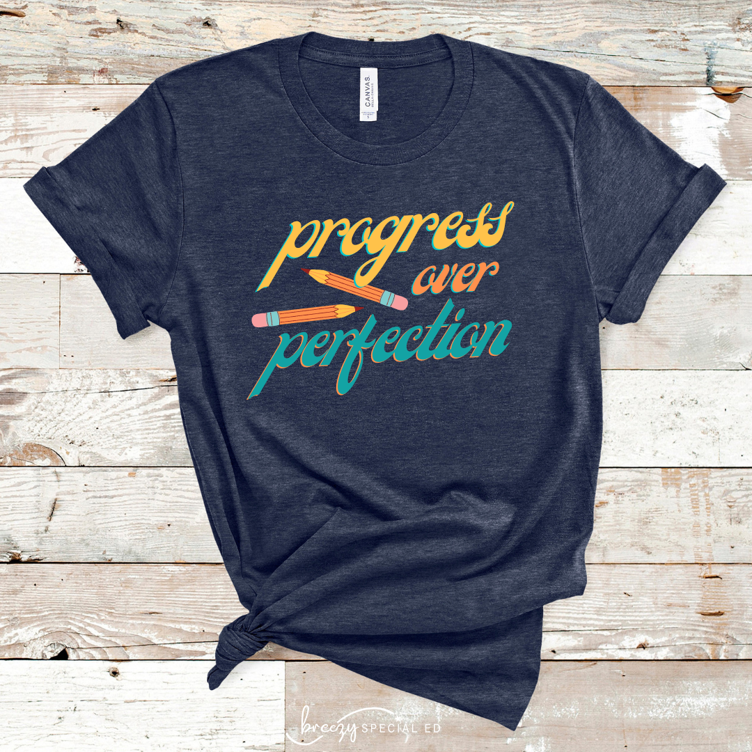 Navy tshirt that says progress over perfection with pencils for teachers