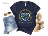 Picture is of a navy heather bella canvas tshirt highlighting Down Syndrome Awareness shirt with yellow, blue and white outlined hearts and arrows in the middle. Text around the heart says "Imagine a World with Extra Love" and "down syndrome awareness" at the bottom in cursive